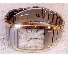 Klasszikus férfi-női karóra, aranyozott sávos csattal. Goldlis Quartz