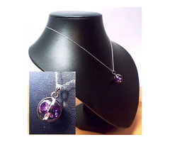 Gömbbe foglalt, csiszolt kristálymedál 22mm