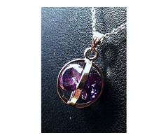 Gömbbe foglalt, csiszolt kristálymedál 22mm