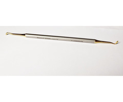 Modern aranyozott fogorvosi eszköz. Polírozó kompozit illesztéséhez.